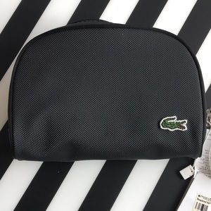 Lacoste Midnight black zippered makeup pouch. New with tags.